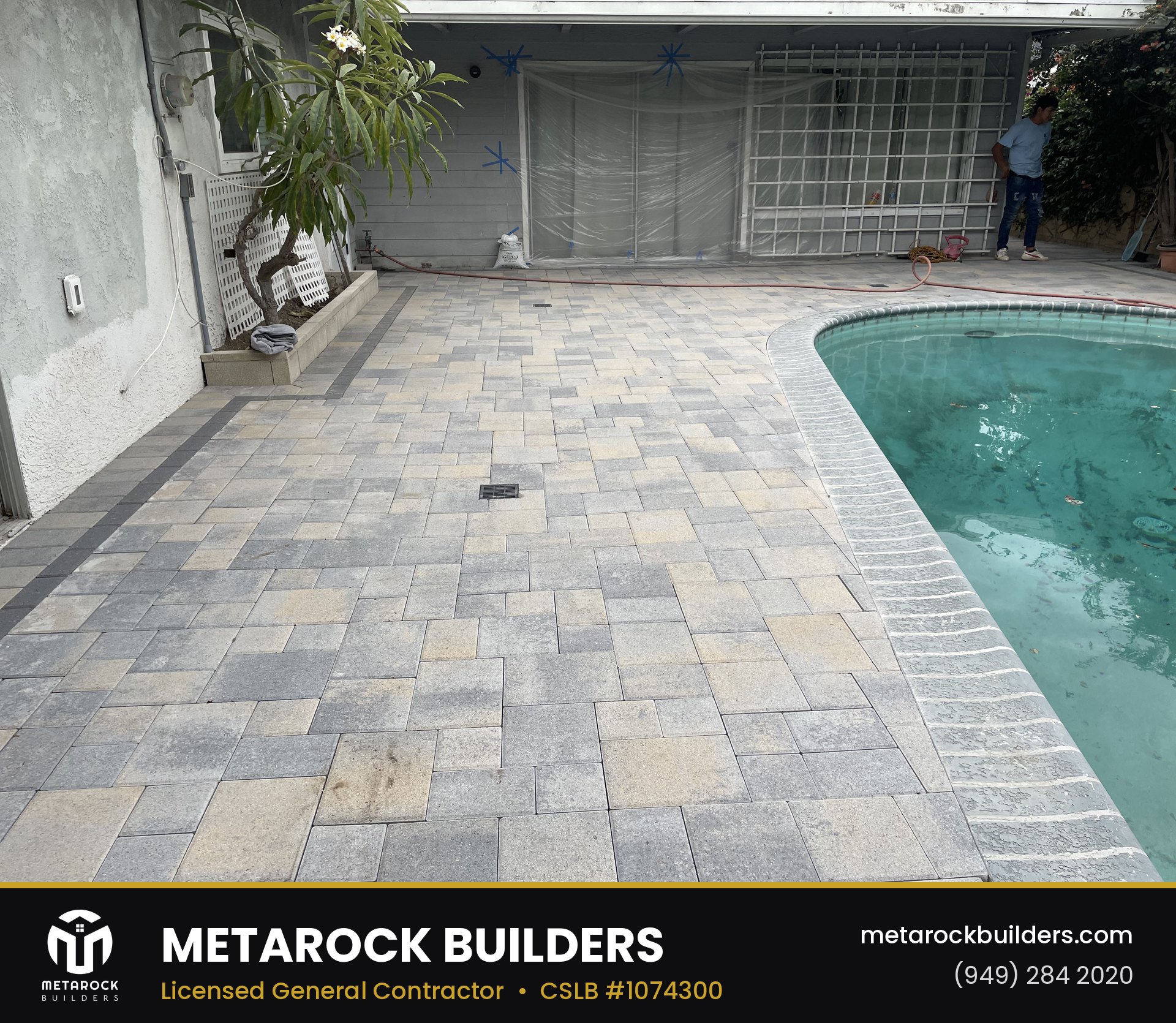 Landscaping in Orange County by Sunward Builders Inc., completed after photo with two-tone stone paver deck around a curved pool with new bullnose coping